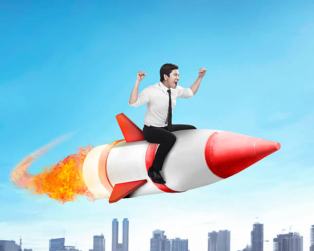 istock Asian business man flying ride rocket 522002452