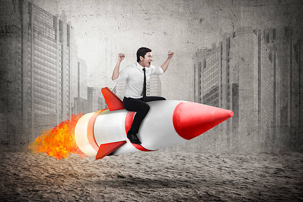 istock Asian business man riding rocket 522003150