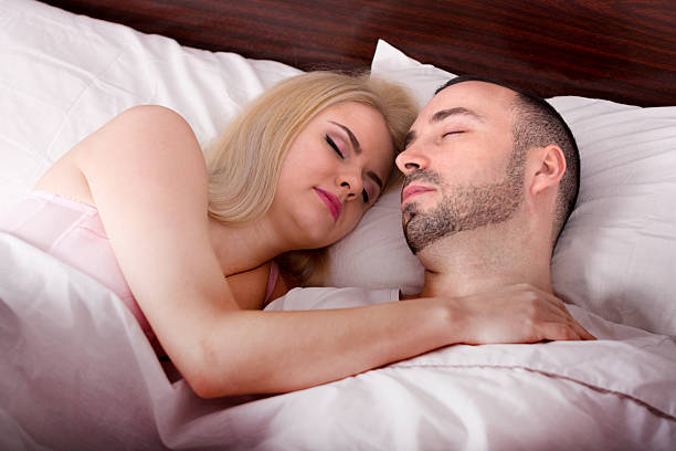 istock man and girl sleeping and hugging 522004280