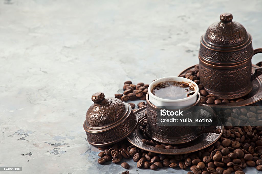 Coffee in Turkish style Two cups of coffee on marble background Copper Stock Photo
