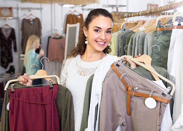 istock Girl selecting new garments at the store 522006998