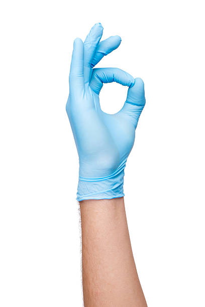 istock Hand in blue glove showing OK sign 522018071