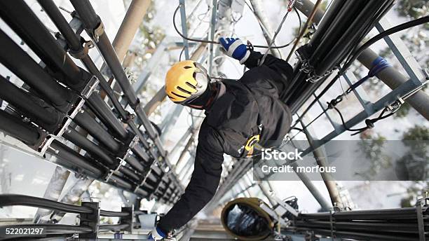 Telecommunication Manual High Worker Engineer Repairing Antenna Stock Photo - Download Image Now