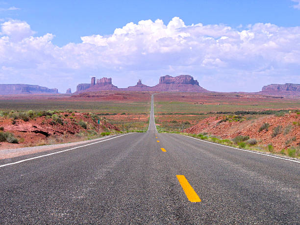 Straight road in Utah and Arizona, Monument Valley Navajo Tribal Straight road Utah and Arizona, Monument Valley Navajo Tribal Park, United States of America kayenta photos stock pictures, royalty-free photos & images
