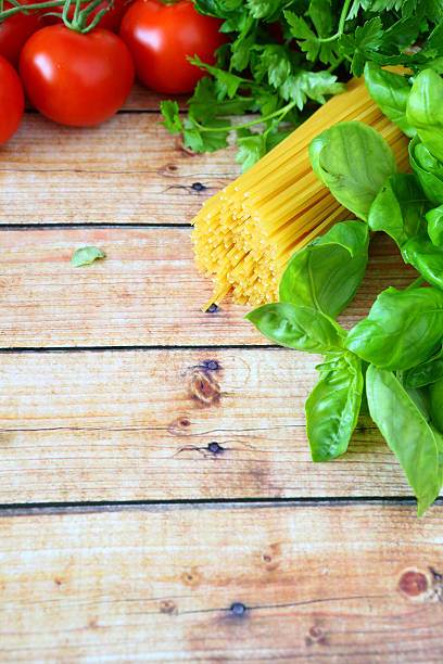 ingredients for pasta on wooden background
