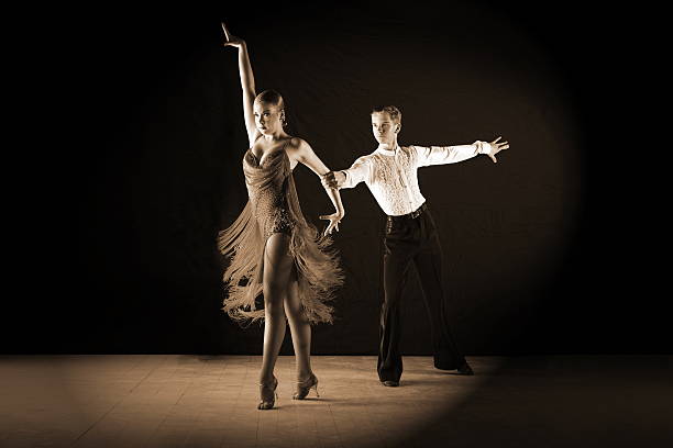 istock dancers in ballroom against on black 522031835