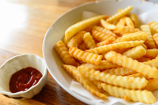 istock French fries closeup over wood 522032471
