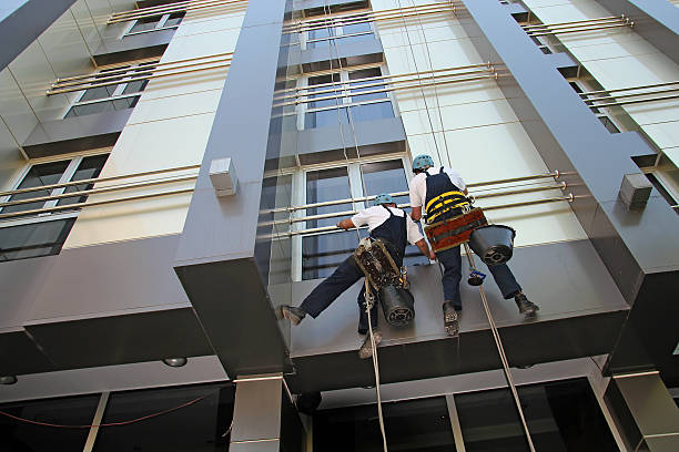 istock Industrial Climbers Washing Facade of a Modern Building 522033219