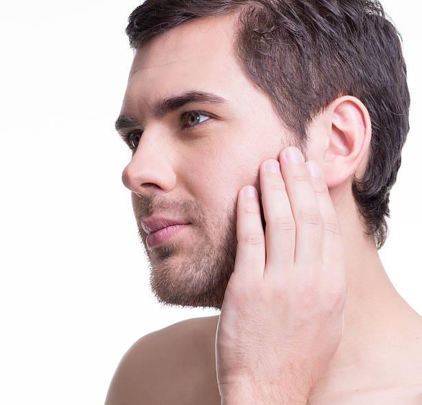 istock Handsome man with hand near the face. 522034593