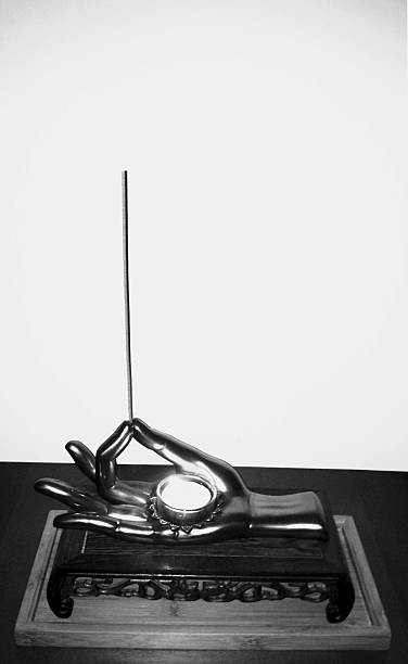 istock Burning Tealight In A Palm Holding An Incense Stick. 522036025