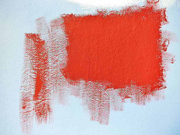 istock Test painting the blue wall with red color 522037495