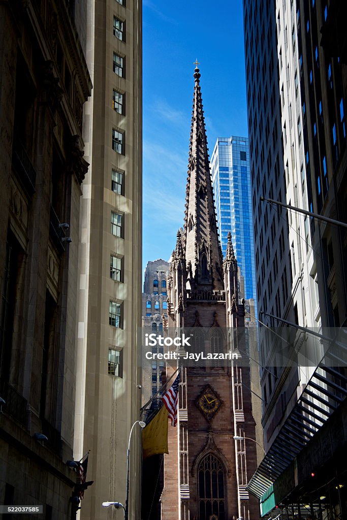 NYC Urban Density Cityscape, Manhattan Financial District, Trinity Church A Lower Manhattan Financial District cityscape view of various architectural eras and styles of office buildings and the historic Trinity Church at Wall Street & Broadway, New York City. 19th Century Style Stock Photo