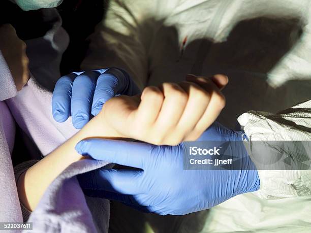 Medical Worker Working With Ebola Patient Stock Photo - Download Image Now - Cold And Flu, Doctor, Ebola