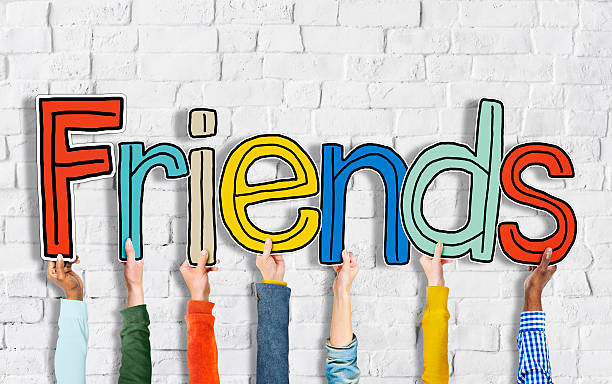 istock Group of Hands Holding Word Friends 522051109