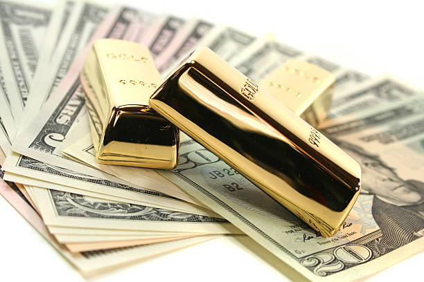 istock Gold bullion on dollar bills 522051753