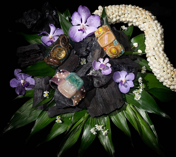 istock bracelets surrounded by flowers, coals and leaves 522052929
