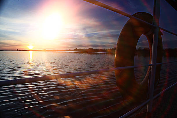 istock sunset on the boat lifebuoy on board 522053469