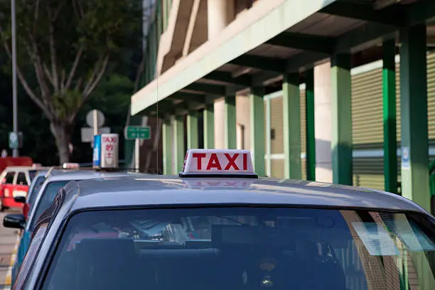 A taxi waiting for a passenger at a taxi stand near Tsingyi MRT station.