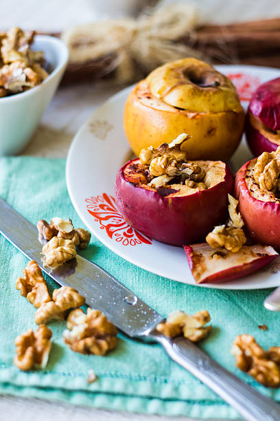 istock baked apples with walnuts, honey and cinnamon, dessert 522054867