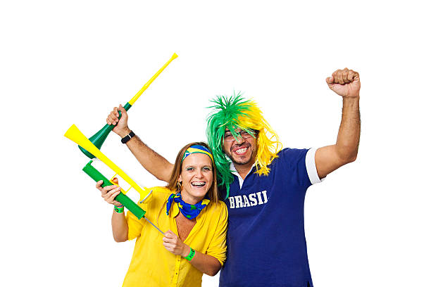 Brazilian couple supporters Brazilian couple supporters on white background. vuvuzela stock pictures, royalty-free photos & images