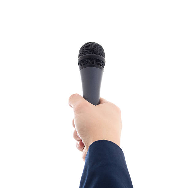 hand holding a microphone isolated on white stock photo