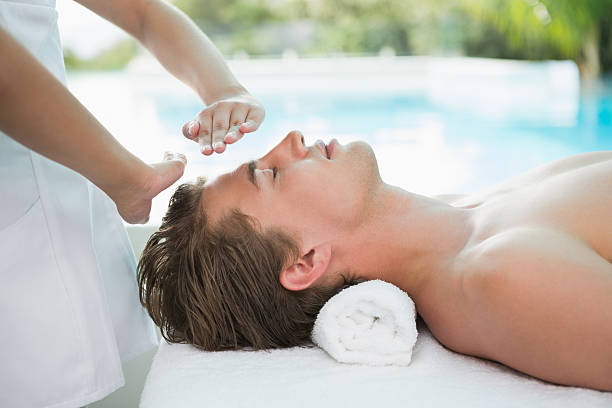 istock Handsome man receiving treatment at spa center 522055561