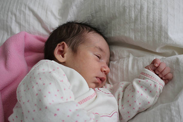 istock sleeping newborn baby girl 522055779