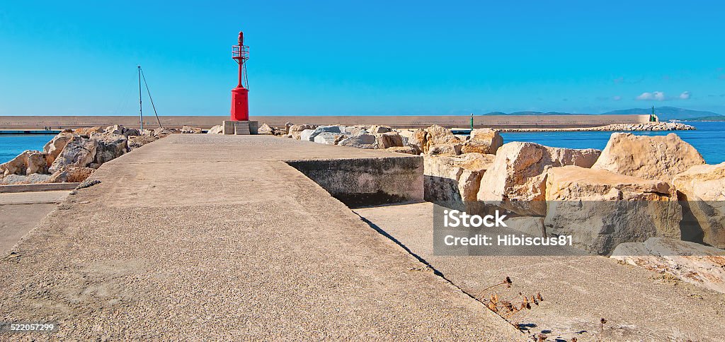 lighthouse in Alghero harbor red lighthouse in Alghero harbor on a clear day Alghero Stock Photo