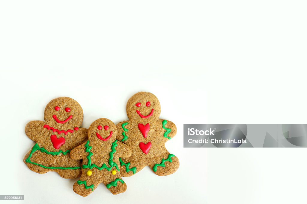 Christmas Gingerbread Cookie Family Isolated on White Background A  Christmas Gingerbread cookie family of man, woman, and child is isolated on a white background, with copy-space for text or to use as a greeting card. Child Stock Photo