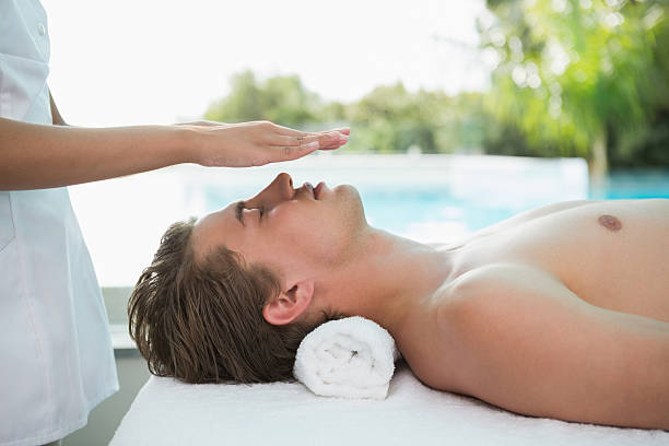 istock Handsome man receiving treatment at spa center 522074571