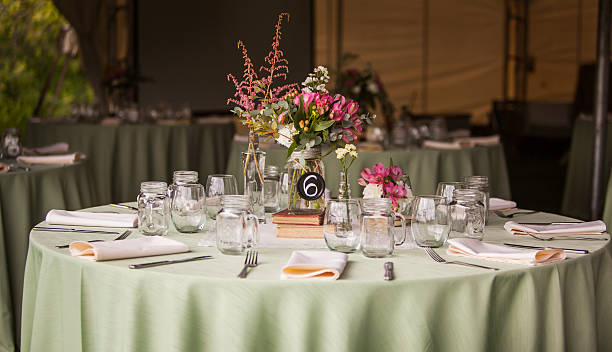 Wedding Reception Table A table at a wedding reception awaiting guests. wedding hall stock pictures, royalty-free photos & images