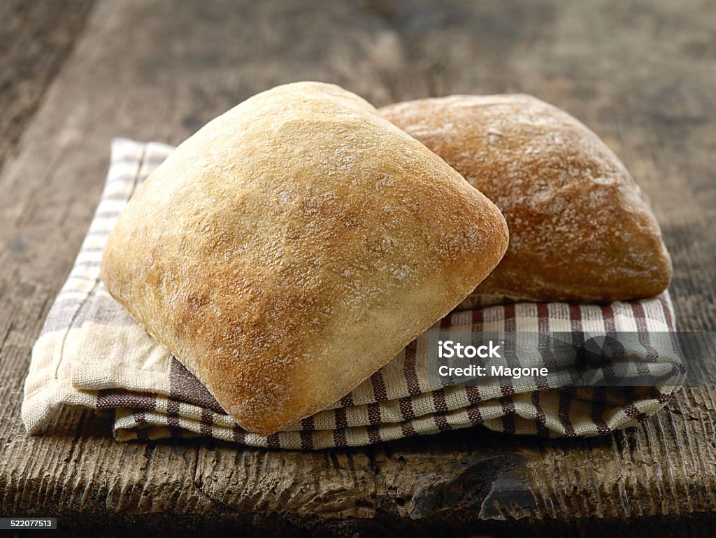two ciabatta bread buns two ciabatta bread buns on wooden table Ciabatta Stock Photo
