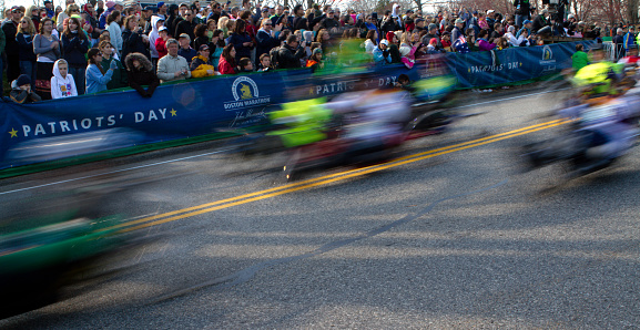 Hopkinton, Massachusetts, USA, - April 18, 2011: Participants using handcycles in the Boston Marathon start the event while spectators watch.