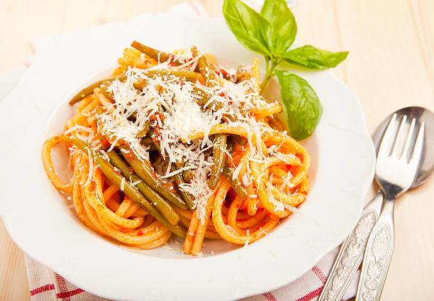 istock pasta with tomato sauce and green beans. Parmesan cheese. fresh 522093449