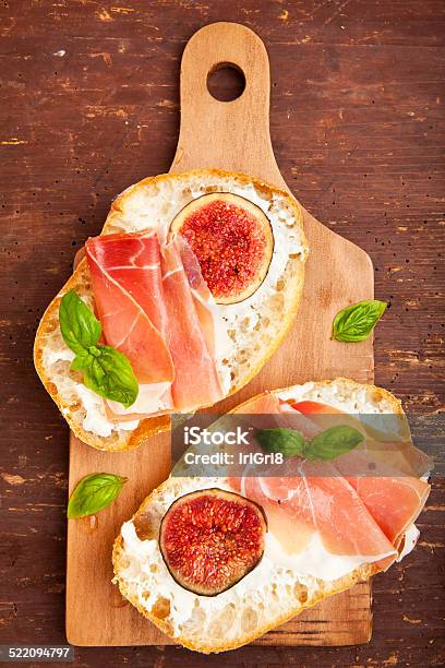 Bruschetta With Prosciutto Ham Figs With White Cheese Stock Photo - Download Image Now