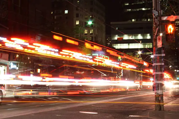 street car on street at night in Toronto, long exposure