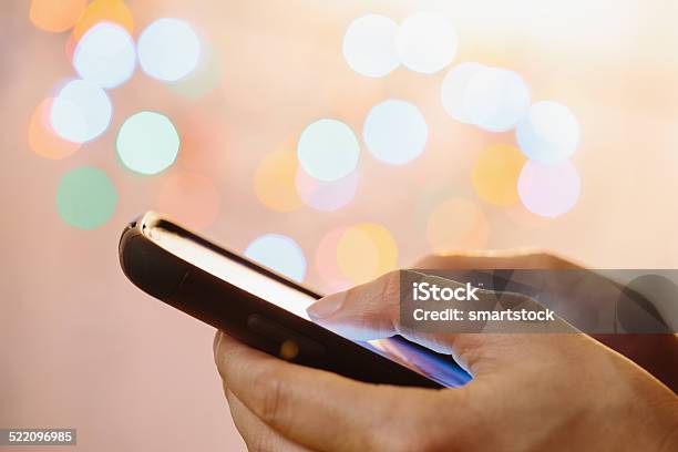 Closeup Of Woman Using Thumbs To Type On Mobile Phone Stock Photo - Download Image Now