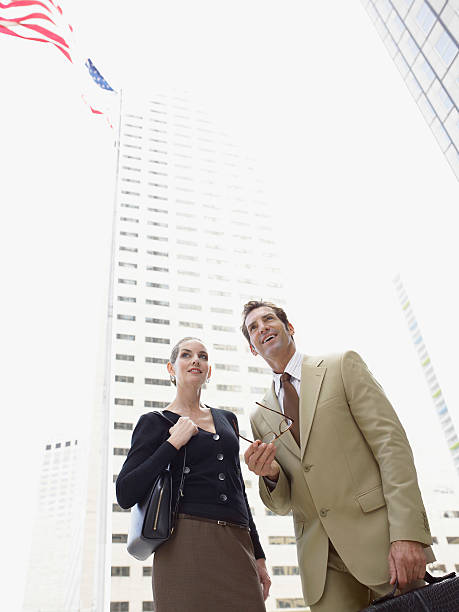 istock Businesspeople Looking Away Against Office Building 522113149