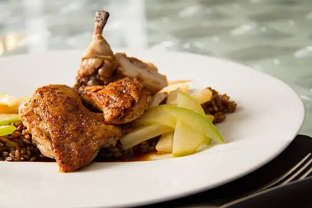 Roasted cornish game hen with toasted rye berries, compressed apple, caramelized salsify, and chartreuse jus