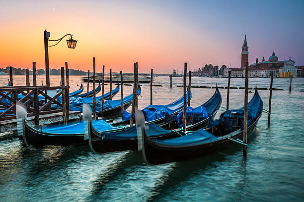 istock Swinging gondolas in Venice at dawn 522114929