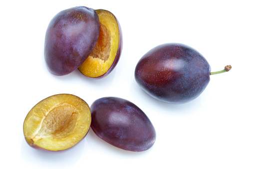 studio shot of fresh plums