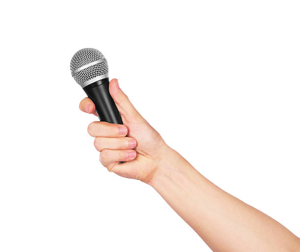 istock Male hand holding microphone 522123936