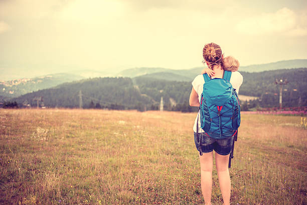 istock Mother with baby at mountain peak 522125338