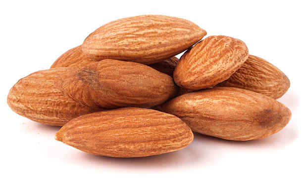 istock heap of almonds isolated on white background 522126168