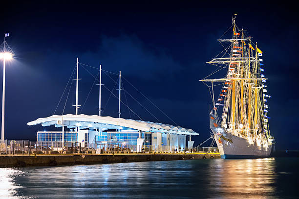 istock Ancient sailing ship in a modern port 522127070