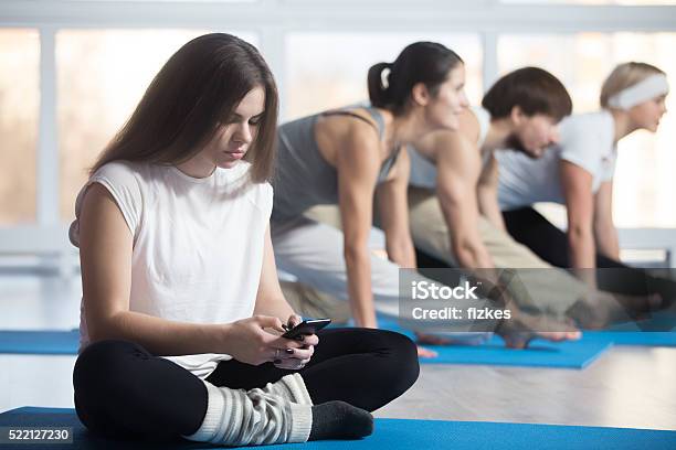 Woman Playing With Phone Instead Of Sport Training Stock Photo - Download Image Now - Disgust, Exercising, Relaxation Exercise