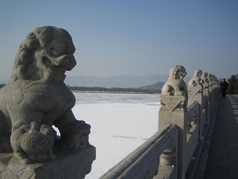 Sclupture of a chinese dragon decorating an ancient bridge near the yellow mountains.