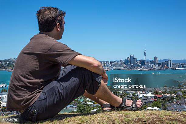 Man Sitting And Looking At City Of Auckland New Zealand Stock Photo - Download Image Now