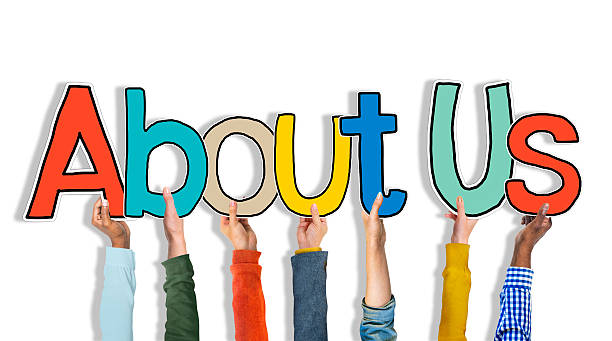 istock Multiethnic Group of Hands Holding Word About Us 522131327