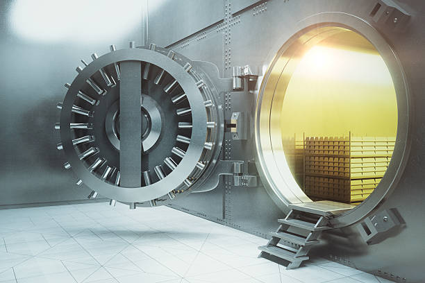 Bank vault with gold stacks side Sideview of an open bank vault with gold stacks. 3D Render digital repository stock pictures, royalty-free photos & images